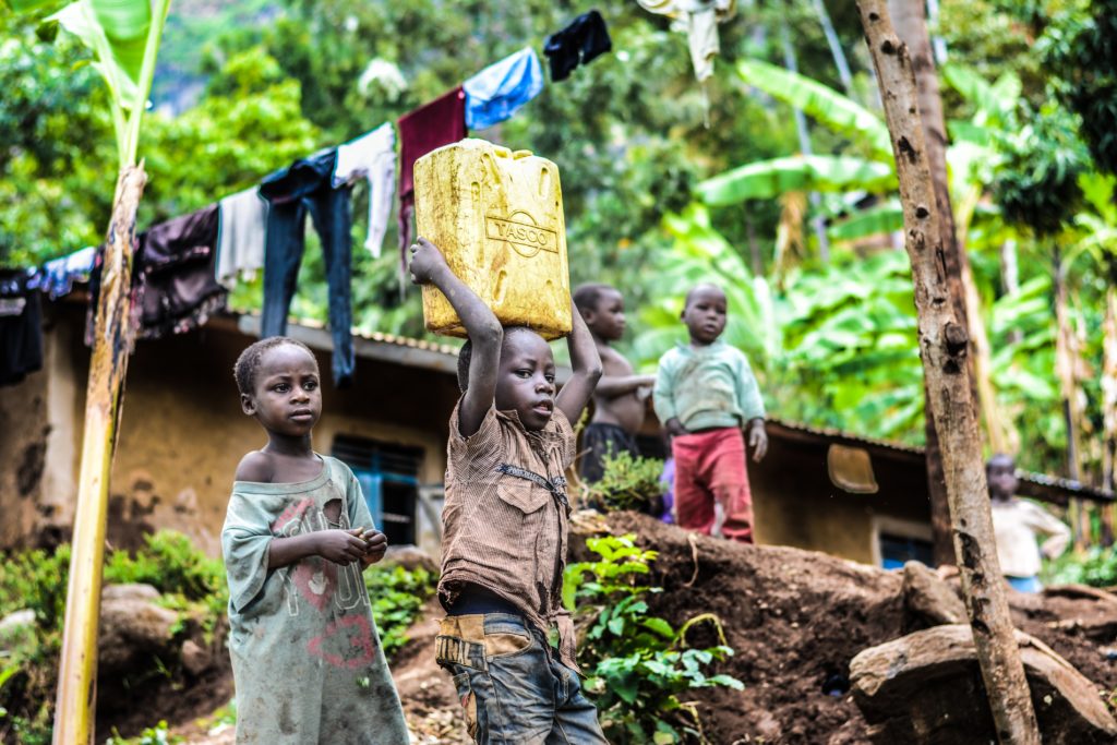 What is Wisdom? Picture of African children with one carrying a tub of water on their head